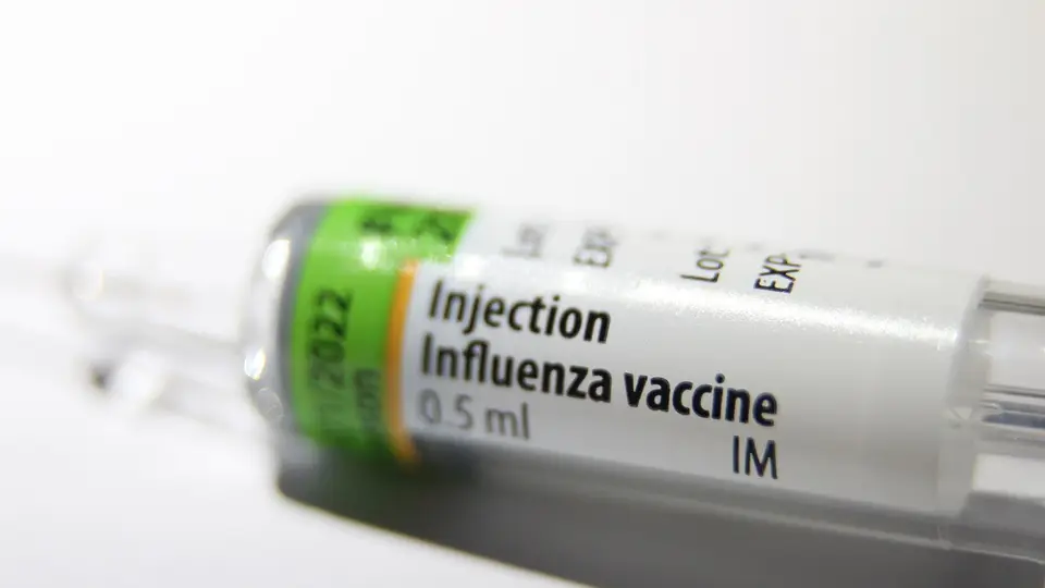 A prefilled syringe labelled influenza vaccine, 0.5 ml
