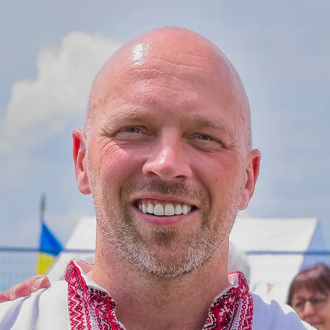 Brad Bradford, smiling, at an outdoor community celebration in Toronto in 2026